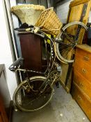 A LADY'S PUCH BICYCLE WITH SHOPPING BASKET