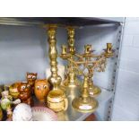 PAIR OF BRASS CANDLESTICKS AND TWO BRASS CANDELABRUM