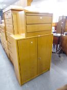 A 'HULSTA' TALL CHEST OF SEVEN DRAWERS AND A MATCHING TWO DRAWER CHEST, A TWO DOOR CUPBOARD AND A