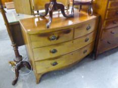 A NINETEENTH CENTURY LOW BOW FRONT MAHOGANY CHEST OF TWO SHORT AND TWO LONG DRAWERS