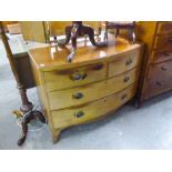 A NINETEENTH CENTURY LOW BOW FRONT MAHOGANY CHEST OF TWO SHORT AND TWO LONG DRAWERS