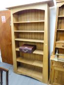 A HARDWOOD ARTS AND CRAFTS STYLE OPEN BOOKCASE OF SIX TIERS WITH FIXED SHELVES, 3'6" WIDE