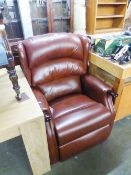 A LIGHT BROWN LEATHER RECLINING ARMCHAIR