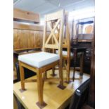 A PAIR OF MODERN LIGHT OAK DINING CHAIRS WITH 'C' BACKS AND PAD SEATS (2)