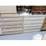 A MODERN CREAM PAINTED WOOD CHEST OF DRAWERS WITH AN ARRANGEMENT OF FOUR LONG AND TWO SHORT DRAWERS,