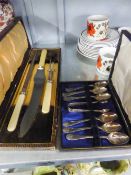 A BONE HANDLED CARVING SET, IN ORIGINAL BOX AND A SET OF SIX ELECTROPLATE COFFEE SPOONS WITH SUGAR