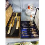 A BONE HANDLED CARVING SET, IN ORIGINAL BOX AND A SET OF SIX ELECTROPLATE COFFEE SPOONS WITH SUGAR