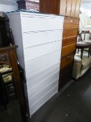 A PAIR OF WHITE PAINTED CHESTS EACH OF FOUR LONG DRAWERS AND THE LOOSE PLATE GLASS PROTECTORS, 2'