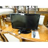 A 22" SAMSUNG FLATSCREEN TV AND REMOTE CONTROL