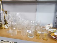 A QUANTITY OF CUT GLASS DRINKING GLASSES, SOME WITH ETCHED DETAIL