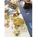 A BRASS FIRESIDE COMPANION STAND WITH FOUR APPLIANCES; A PIERCED BRASS CIRCULAR TRIVET; A COPPER