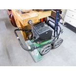 A PETROL DRIVEN ROTARY LAWN MOWER