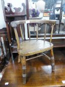 A CHILD'S ANTIQUE ELM TUB SHAPED CHAIR WITH PANEL SEAT