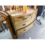 A NINETEENTH CENTURY LOW BOW FRONT MAHOGANY CHEST OF TWO SHORT AND TWO LONG DRAWERS