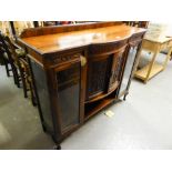 A LOW DISPLAY CABINET WITH TWO BOWED DOORS, FLANKED BY TWO GLASS DOORS (lacks top)