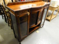 A LOW DISPLAY CABINET WITH TWO BOWED DOORS, FLANKED BY TWO GLASS DOORS (lacks top)