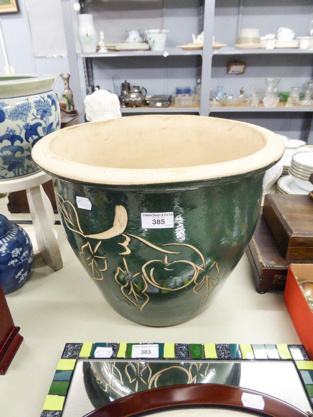 LARGE AND HEAVY GREEN GLAZED LARGE POTTERY JARDINIERE WITH INCISED DECORATION OF A FRUITING APPLE