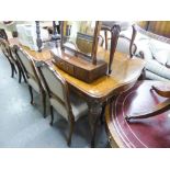 A BURR WALNUTWOOD EXTENDING DINING TABLE OF EPSTEIN STYLE ON CABRIOLE LEGS AND MATCHING SET OF SIX