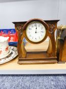 SWISS WALNUTWOOD ART DECO MANTEL CLOCK, THE DIAL RAISED ON FLORAL STEM SUPPORTS ON SOLID BASE