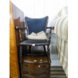 A SMALL HARDWOOD, EARLY 20TH CENTURY NURSING ARMCHAIR WITH UPHOLSTERED BACK AND SEAT COVERED IN