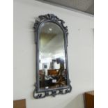 AN ARCHED TOPPED BEVELLED EDGE WALL MIRROR, IN SILVERED FINISH FRAME