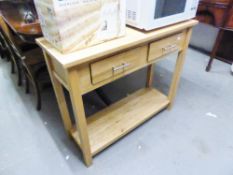 A MODERN LIGHT BEECH WOOD OBLONG SIDE TABLE WITH TWO DRAWERS, ON STRAIGHT SUPPORTS, WITH