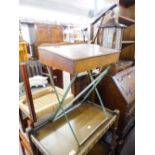 A MID 20TH CENTURY CHILD'S SLOPE TOP DESK HAVING INKWELL ALL RAISED ON METAL 'X' FRAME AND A WHITE