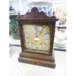 AN EARLY TWENTIETH CENTURY BEECHWOOD CASED MANTEL CLOCK WITH WATERMAN AND HOFFMEISTER MOVEMENT