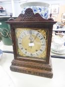 AN EARLY TWENTIETH CENTURY BEECHWOOD CASED MANTEL CLOCK WITH WATERMAN AND HOFFMEISTER MOVEMENT