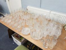 A QUANTITY OF ASSORTED GLASSWARES INCLUDING; DRINKING GLASSES, SUNDAE GLASSES, FRUIT BOWL, JUGS