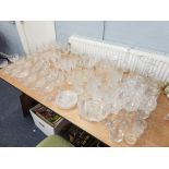 A QUANTITY OF ASSORTED GLASSWARES INCLUDING; DRINKING GLASSES, SUNDAE GLASSES, FRUIT BOWL, JUGS