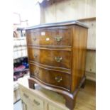 A SMALL MAHOGANY GEORGIAN STYLE SERPENTINE CHEST OF THREE LONG DRAWERS, ON BRACKET FEET, 1'9" WIDE