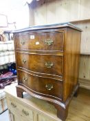 A SMALL MAHOGANY GEORGIAN STYLE SERPENTINE CHEST OF THREE LONG DRAWERS, ON BRACKET FEET, 1'9" WIDE