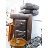 A BROWN LEATHER TWO SEATER SOFA