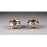 VICTORIAN PAIR OF CHASED SILVER OPEN SALTS BY CHARLES BOYTON, each of typical form with beaded