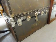 A LARGE FIBRE AND METAL BOUND CABIN TRUNK