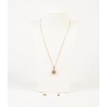 9ct GOLD FINE CHAIN NECKLACE and the matt 9ct GOLD TEAR SHAPED PENDANT, set with a sapphire and