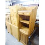 A PINE TALL NARROW UNIT WITH OPEN SHELVES AND CUPBOARD BASE, AND A TALL NARROW CHEST OF FOUR DRAWERS
