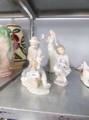 LLADRO FIGURINE OF YOUNG GIRL PLAYING WITH HER TEDDY; NAO FIGURE GROUP OF A YOUNG MAN TEACHING HIS