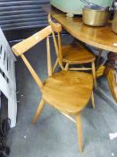 A PAIR OF POLISHED WOOD SINGLE CHAIRS WITH HOOP BACKS AND TWO OTHERS AND A CIRCULAR DINING TABLE (5)