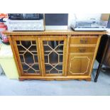 A MAHOGANY SMALL BOOKCASE WITH TWO ASTRAGAL GLAZED DOORS WITH END CUPBOARD AND TWO SHORT DRAWERS
