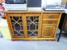 A MAHOGANY SMALL BOOKCASE WITH TWO ASTRAGAL GLAZED DOORS WITH END CUPBOARD AND TWO SHORT DRAWERS