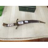 A MIDDLE EASTERN CURVED DAGGER WITH SCABBARD