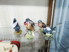 A BESWICK 'NUTHATCH' NO. 2413, A GREY WAGTAIL NO. 1041, A PAIR OF CHAFFINCHES, NO. 991 AND GOLDFINCH