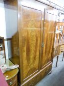 AN EDWARDIAN INLAID MAHOGANY TWO DOOR WARDROBE WITH BASAL DRAWERS