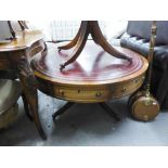 A REPRODUCTION MAHOGANY DRUM TABLE, WITH LEATHER INSET TOP (LOWER)