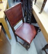 A PAIR OF OAK REPRODUCTION DINING CHAIRS, HAVING PAD BACK AN SEAT WITH STUD DETAILS ON CUP AND COVER