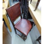 A PAIR OF OAK REPRODUCTION DINING CHAIRS, HAVING PAD BACK AN SEAT WITH STUD DETAILS ON CUP AND COVER