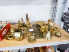 A COLLECTION OF SMALL BRASS WARES TO INCLUDE; HAND BELLS, CANDLESTICK STANDS, AN ASHTRAY ETC...