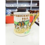 A FIELDINGS CROWN DEVON EMBOSSED POTTERY 'WIDECOMBE FAIR' MUSICAL TANKARD, 4 3/4" HIGH